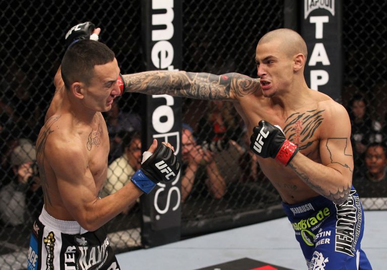 LAS VEGAS, NV - FEBRUARY 04:  Dustin Poirier (right) punches Max Holloway during the UFC 143 event at Mandalay Bay Events Center on February 4, 2012 in Las Vegas, Nevada.  (Photo by Nick Laham/Zuffa LLC/Zuffa LLC via Getty Images) *** Local Caption *** Dustin Poirier; Max Holloway