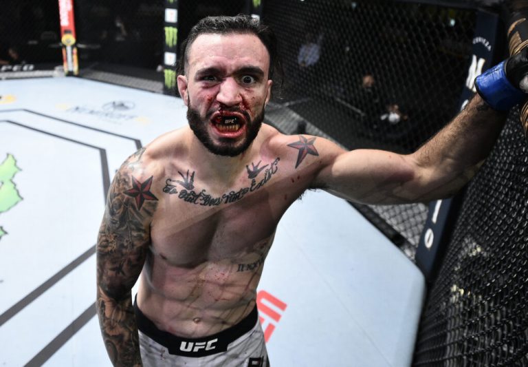 LAS VEGAS, NEVADA - JUNE 20: Shane Burgos reacts after delivering an accidental low blow against opponent Josh Emmett in their feathweight bout during the UFC Fight Night event  at UFC APEX on June 20, 2020 in Las Vegas, Nevada. (Photo by Chris Unger/Zuffa LLC)