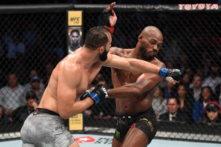 HOUSTON, TEXAS - FEBRUARY 08:  (L-R) Dominick Reyes punches Jon Jones in their light heavyweight championship bout during the UFC 247 event at Toyota Center on February 08, 2020 in Houston, Texas. (Photo by Josh Hedges/Zuffa LLC via Getty Images)