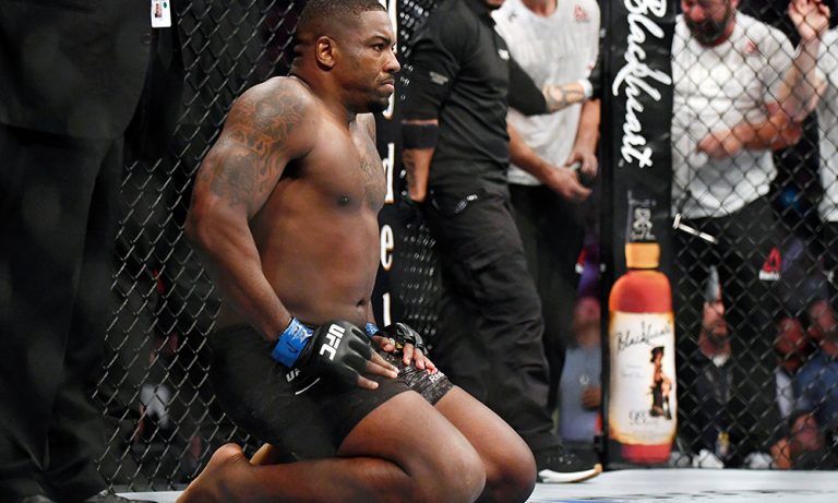Jul 20, 2019; San Antonio, TX, USA; Walt Harris (blue gloves) after his win over Aleksei Oleinik (not pictured) during UFC Fight Night at AT&T Center. Harris won the fight by knock out. Mandatory Credit: Adam Hagy-USA TODAY Sports